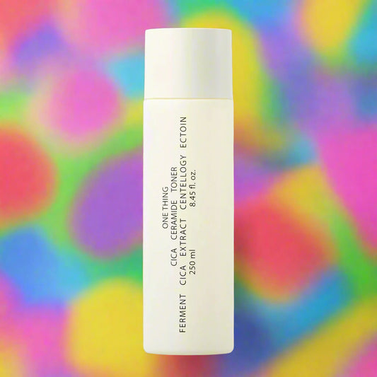 Skincare bottle with text on a white background